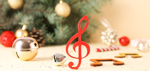 Music notes with Christmas decorations on light background