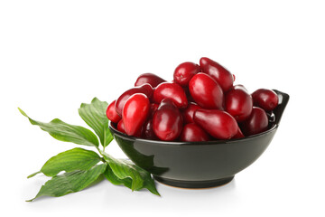 Bowl with ripe red dogwood berries and leaves on white background