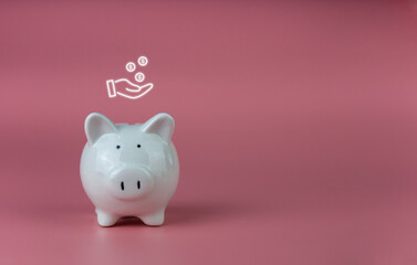 white piggy bank on a pink background. Savings and investment concepts.