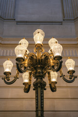 Breathtaking architecture details of panoramic dome columns scenic building interior view with historic walls, chandeliers, brass railings, marble statues in public city hall landmark