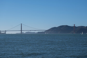 Panoramic scenic aerial view over San Francisco Bay Area with Golden Gate Bridge, downtown skyline cityscape and Alcatraz island sailing boats yachts harbor landmark sights Tower scenery