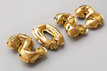 Figure 2023 made of balloons on grey background