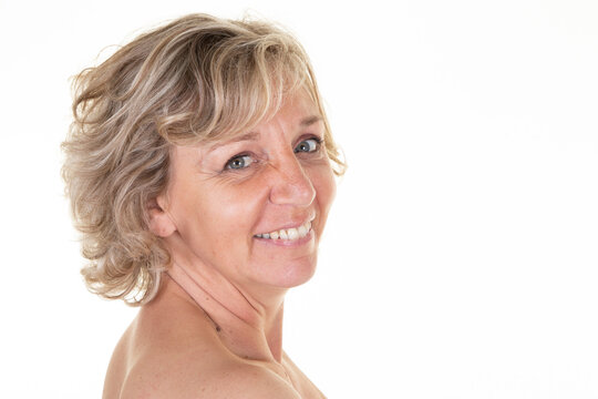 Beauty portrait of an senior blond attractive mature topless woman
