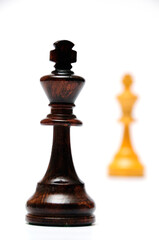 black chess king confronting white chess king