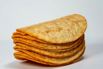 Foto op Plexiglas Closeup shot of the stack potatoes chips isolated on gray background © Abinash T/Wirestock Creators