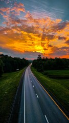 Orange sunset view over the highway road, Vermont, USA, vertical