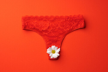 Women's panties with flower buds on paper background