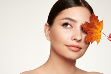 Autumn portrait of beautiful woman with clean fresh skin