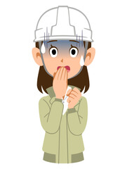 青ざめたヘルメットを被った作業着の女性
