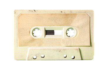 Isolated old vintage cassette tape from the 1980s (obsolete music technology). Vivid colors: dirty cream plastic body, desert sand label.
