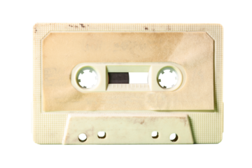 Isolated old vintage cassette tape from the 1980s (obsolete music technology). Vivid colors: dirty cream plastic body, desert sand label.
