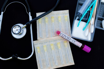 Blood test samples tube, reagent testing tube and swab collection kit in the laboratory,...
