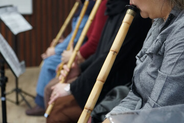 woman learning to play flute