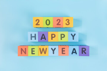 2023 happy new.cloorful cube on blue background. New year change and starting concept.