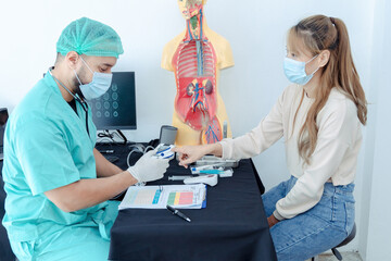  Doctor checking oxygenation with fingertip pulse oximeter. Saturation blood of oxygen. Measuring the patient's blood saturation with an oximeter