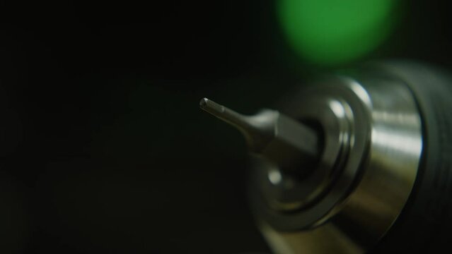 Rotating drill bit micro head, macro extreme close-up, technology and toolkit concept