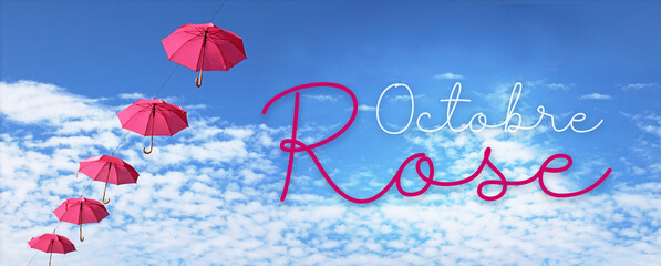 Octobre rose, parapluie rose dans le ciel bleu, concept bannière
