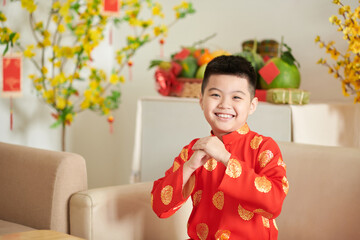 Vietnamese boy Making Ao Dai gesture