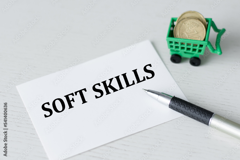Poster a white business card with soft skills text stands on a desk