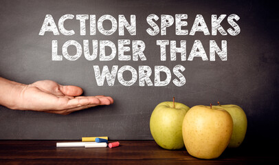 Action Speaks Louder Than Words Concept. Teacher's desk