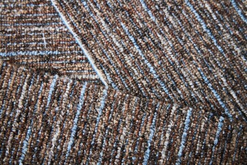 The texture of pieces of carpet with fine pile.
