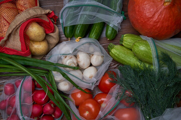 Healthy food vegetables in Eco-friendly packaging reusable bag on wooden table background.