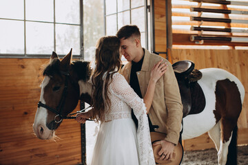 Loving couple on a ranch in the west in the winter season.