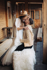 Loving couple on a ranch in the west in winter