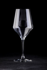 Empty cocktail glass, on a black background