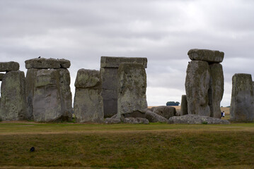 Naklejka premium Famous UNESCO World Heritage Site Stonehenge on Salisbury Plain in Wiltshire on a cloudy summer day. Photo taken August 2nd, 2022, Stonehenge, England.