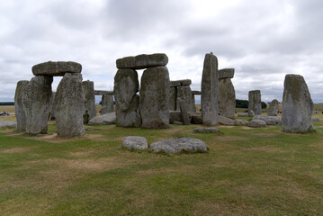Famous UNESCO World Heritage Site Stonehenge on Salisbury Plain in Wiltshire on a cloudy summer day. Photo taken August 2nd, 2022, Stonehenge, England.