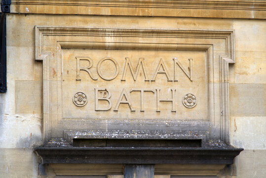 Lettering at famous roman bath at City of Bath on a cloudy summer day. Photo taken August 2nd, 2022, Bath, United Kingdom.