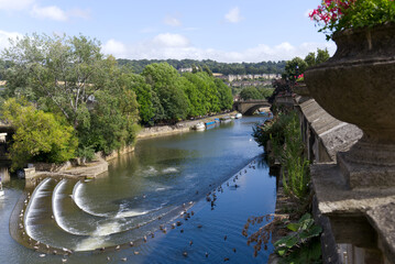 Scenic view of Avon River at famous City of Bath on a blue cloudy summer day. Photo taken August 2nd, 2022, Bath, United Kingdom.