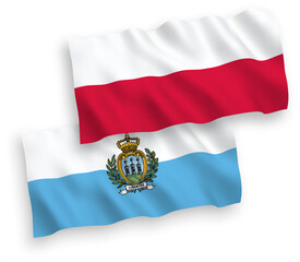 National vector fabric wave flags of San Marino and Poland isolated on white background. 1 to 2 proportion.