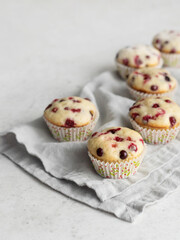 Cranberry muffins on linen napkin with text space