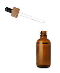 Dripping essential oil into glass bottle on white background