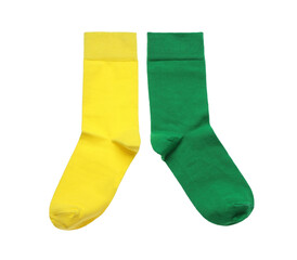 Different colorful socks on white background, top view