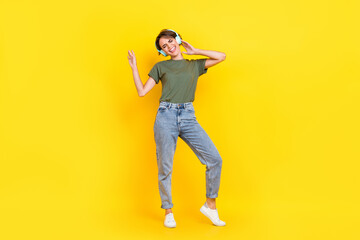 Fototapeta na wymiar Full length photo of pretty positive lady music lover dressed stylish clothes free time playlist isolated on yellow color background