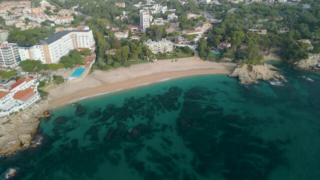 Platja de Aro on the Costa Brava in Girona aerial drone images high standing luxury tourist city Girona spectacular paradisiacal beach turquoise blue transparent water