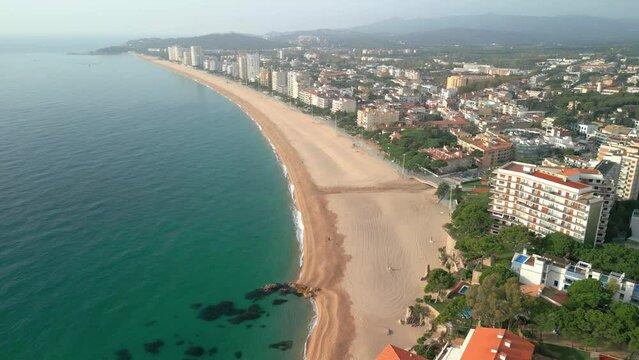 Platja de Aro on the Costa Brava in Girona aerial drone images high standing luxury tourist city Girona spectacular paradisiacal beach turquoise blue transparent water