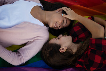 beautiful lesbian young couple embraces. Girls enjoy at the beach..