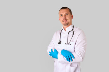 Male doctor portrait wearing white coat and stethoscope