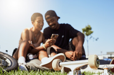 Couple, phone or bonding in skateboard park, nature garden or grass field on internet search, trick...