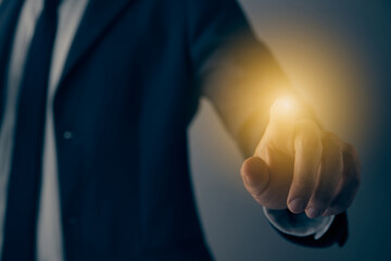 Businessman Hand and Finger Press or Touch Screen or Virtual Button in Vintage Tone