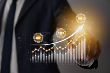 Businessman Hand and Finger Press or Touch Stock Graph and 2023 Trend Icon