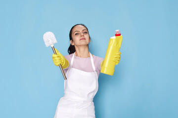 woman in gloves and cleaner apron holding toilet brush