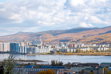 Obraz premium Panorama of an industrial city against a cloudy sky.