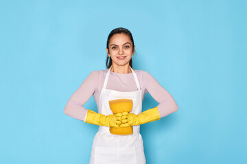 woman in gloves and cleaner apron holding toilet brush