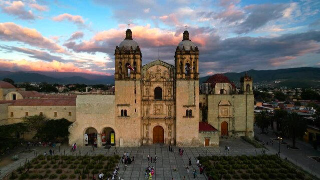 fixed drone shot of santo domingo temple world heritage site in oaxaca city mexico at sunset