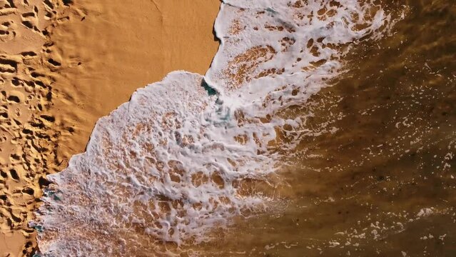 Fabulous Shot Of Wave Coming Over Foot Print In Sand Erasing It, Ericeira Portugal